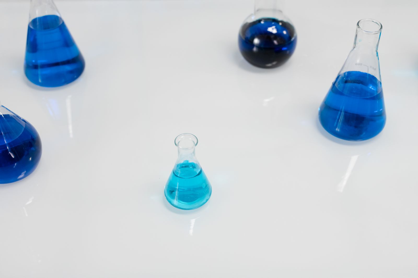 Glass laboratory flasks arranged in a research setting