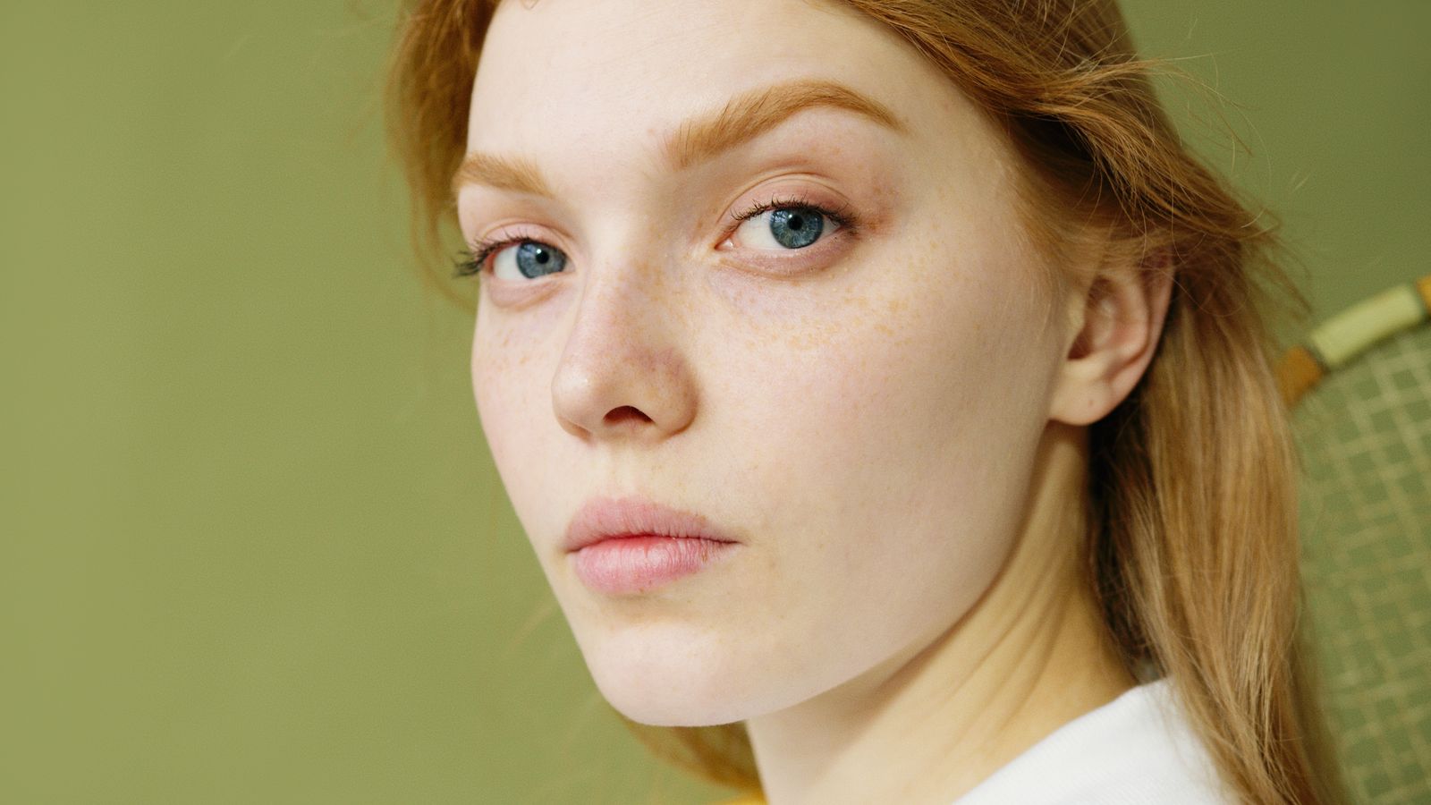 Close portrait of a woman with natural skin in soft light