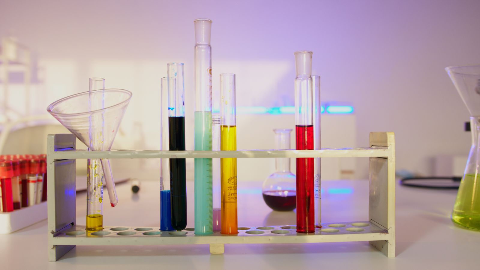 Test tubes filled with coloured liquid in a modern laboratory