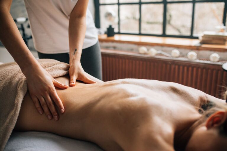A massage session in a warm indoor setting