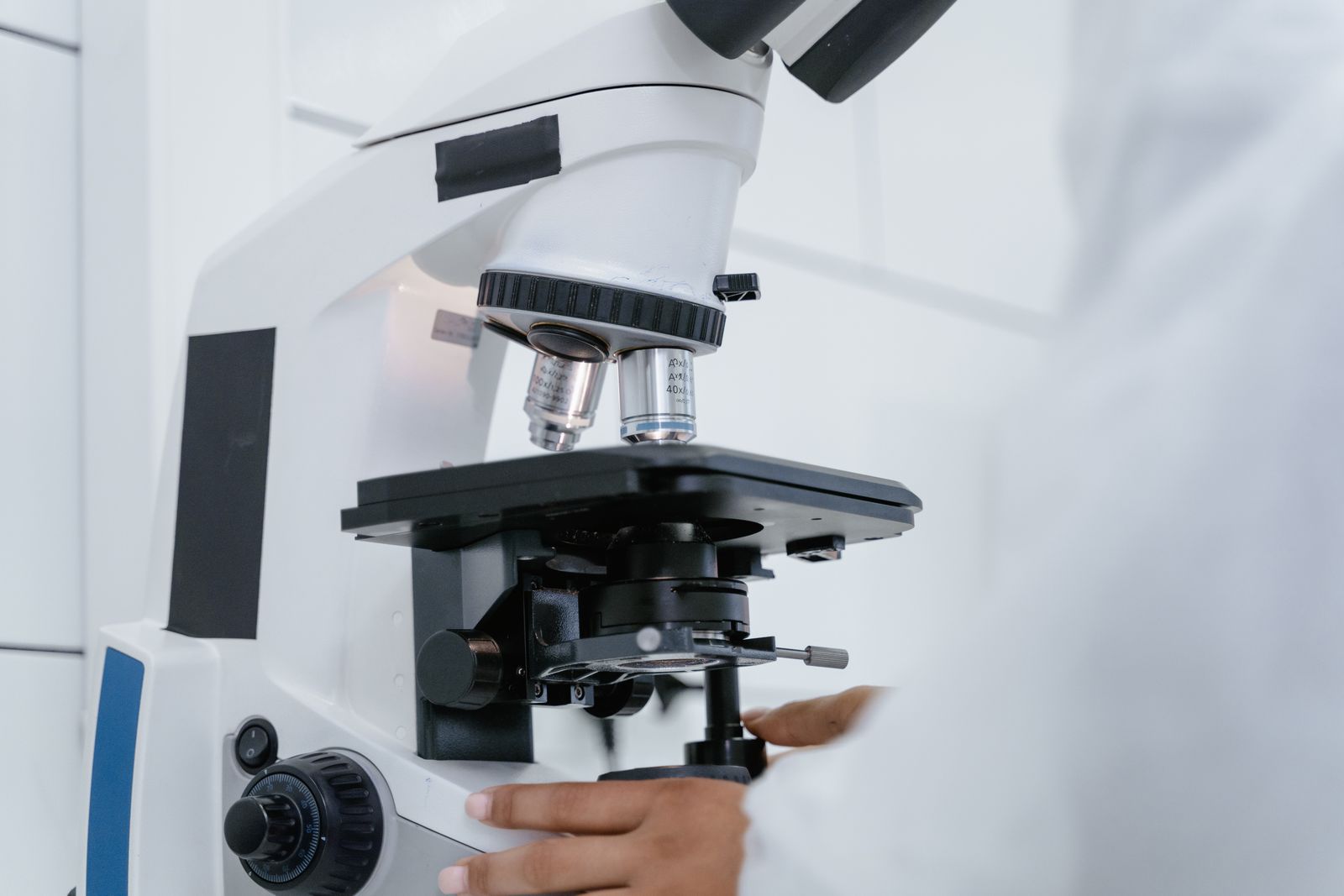 Close view of a microscope being operated in a research laboratory
