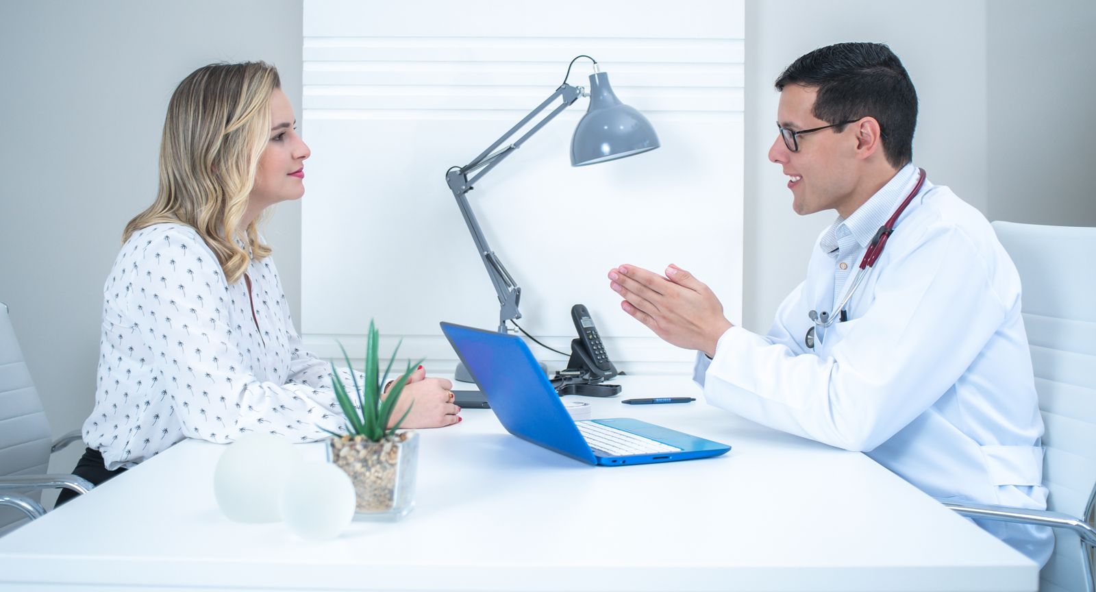 A consultation taking place in a bright medical office