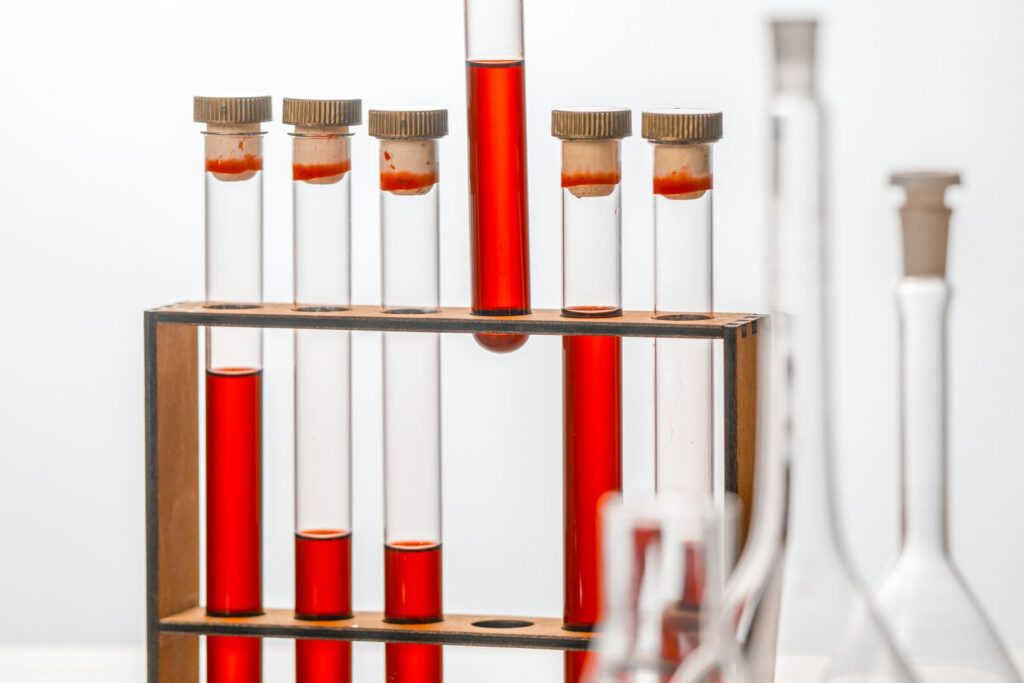 Test tubes filled with red solution in a laboratory