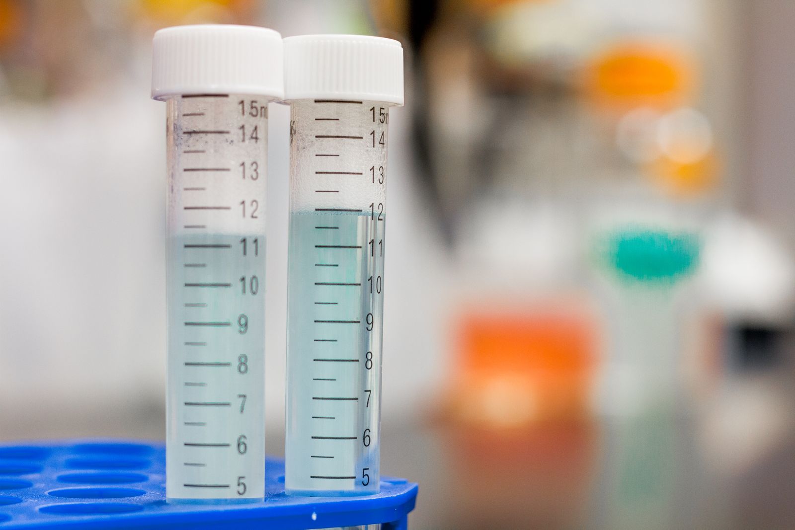 Two laboratory test tubes holding clear solution