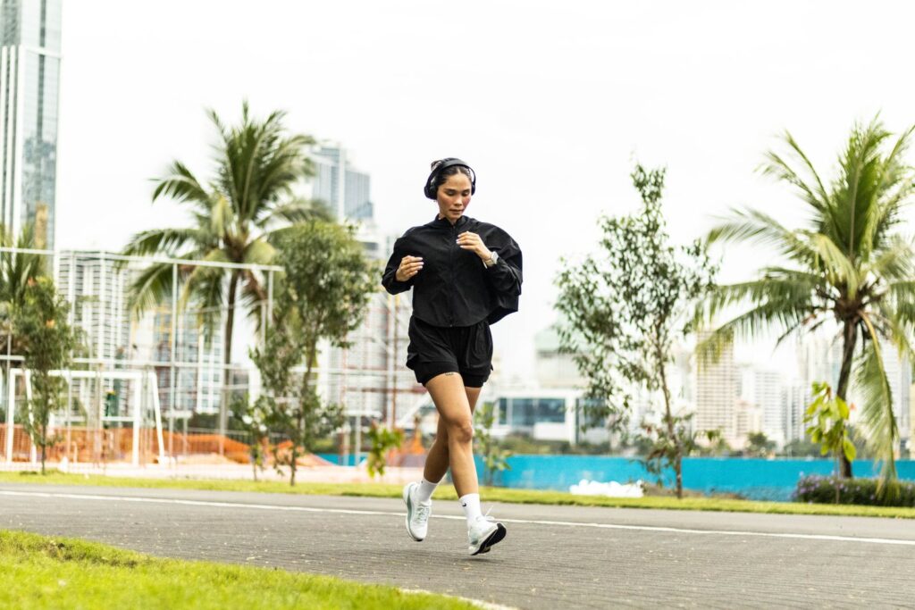 A woman on a morning run through a park